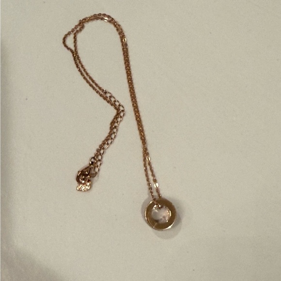 Swarovski Jewelry - Swarovski rose gold circle pendant with floating diamonds, New condition!